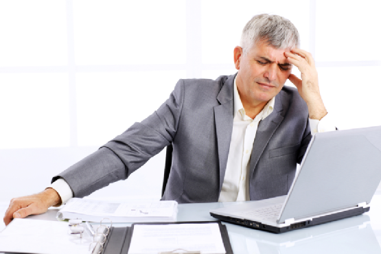 Worried businessman looking at business results