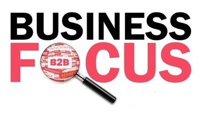 an image of the words business focus with a magnifying glass on focus