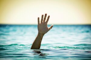 hand above water line drowning