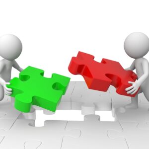 two characters putting a jigsaw together connecting marketing and sales
